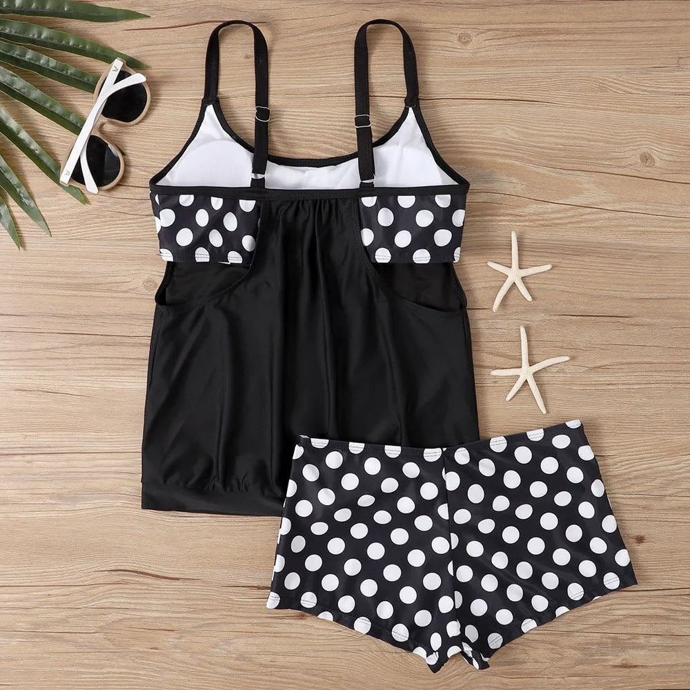Women's black polka dot high-waist boxer swimsuit made of polyester fabric.