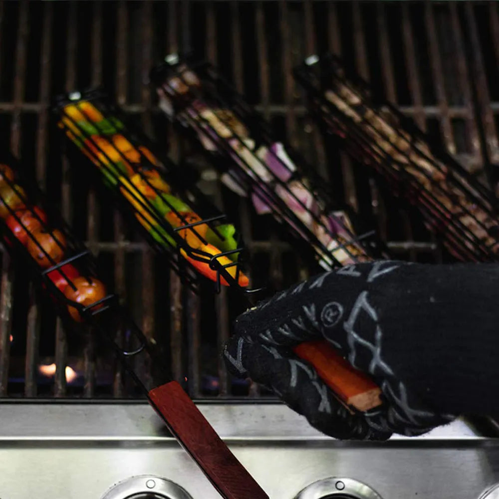 Stainless steel mesh barbecue basket with a wooden handle and rotary locking lid for outdoor grilling.