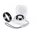 Black ceramic smart ring for health monitoring on a finger.