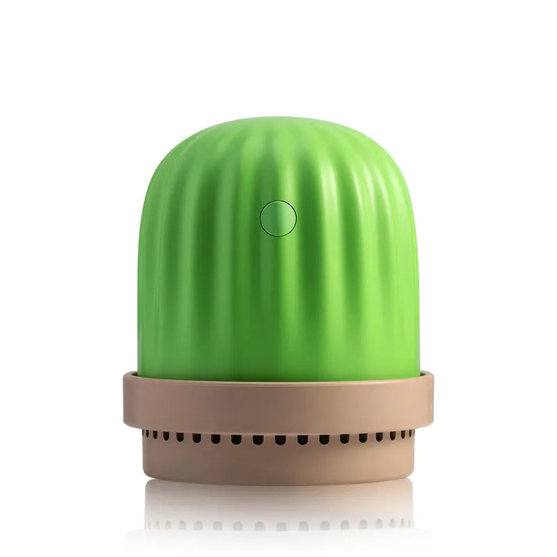 Cactus humidifier night light in green with colourful LED glow on a wooden desk