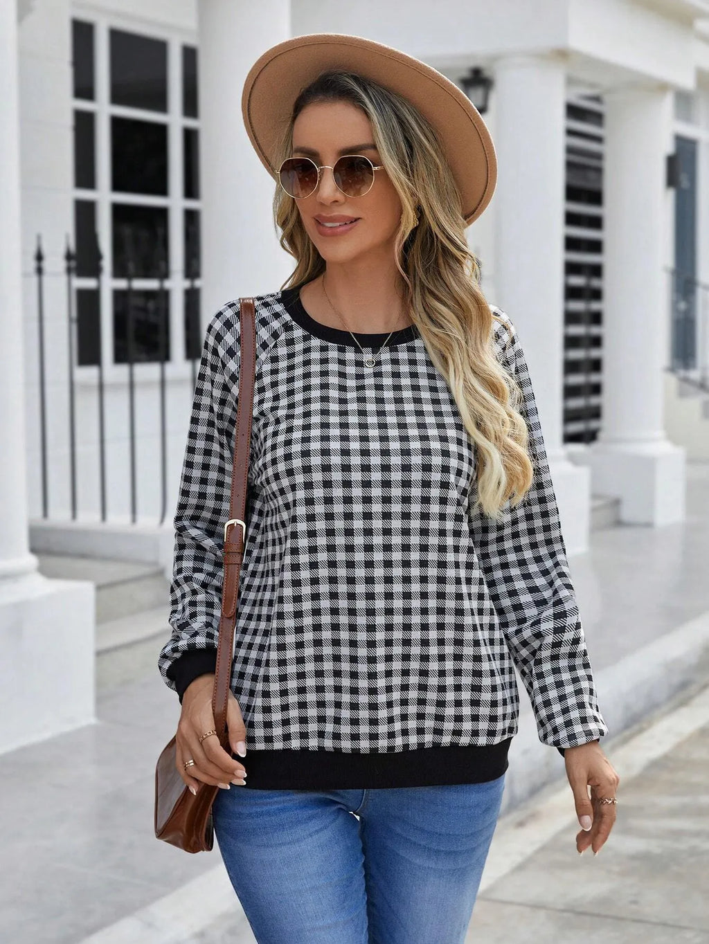 Black plaid stripe long sleeve pullover sweater laid flat, showing Japanese style pattern.