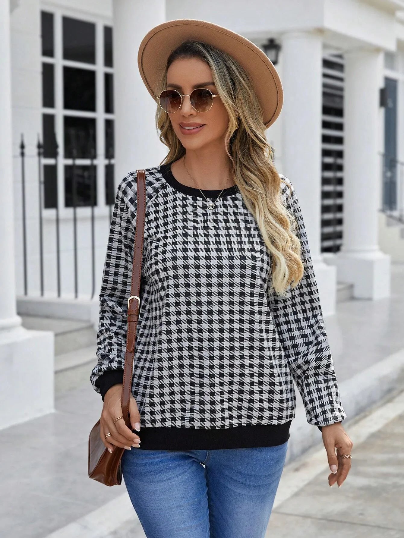 Black plaid stripe long sleeve pullover sweater laid flat, showing Japanese style pattern.