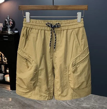 Men's camouflage cargo shorts in a loose fit with cargo pockets, shown in khaki colour.