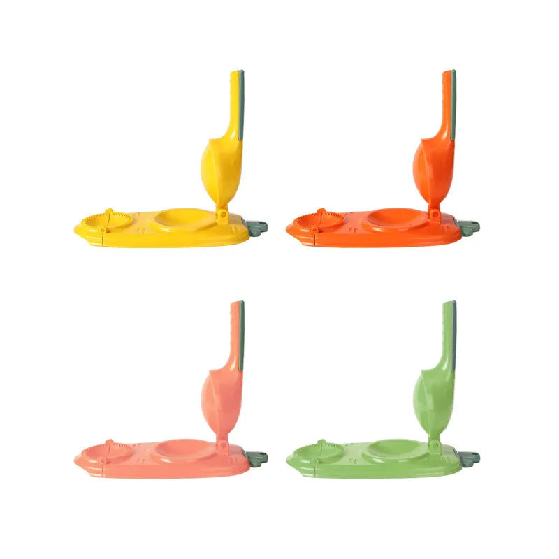 Orange and white plastic manual dumpling maker tool with press and mould.