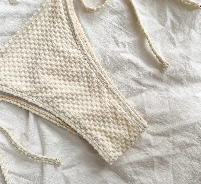 Women's halter lace-up bikini swimsuit in polyester fabric shown in milky white colour