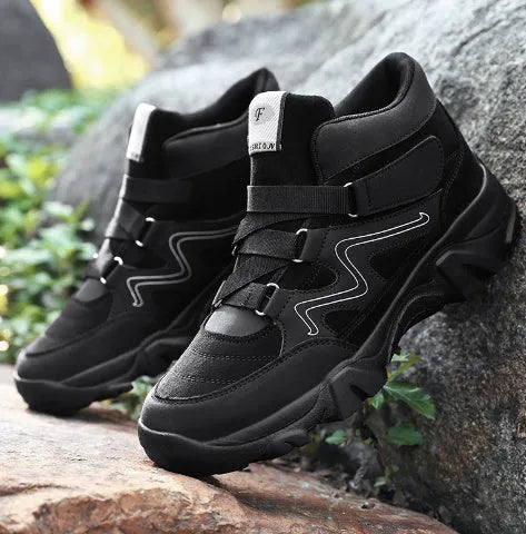 Men's black casual lace-up shoes with rubber sole on a plain background