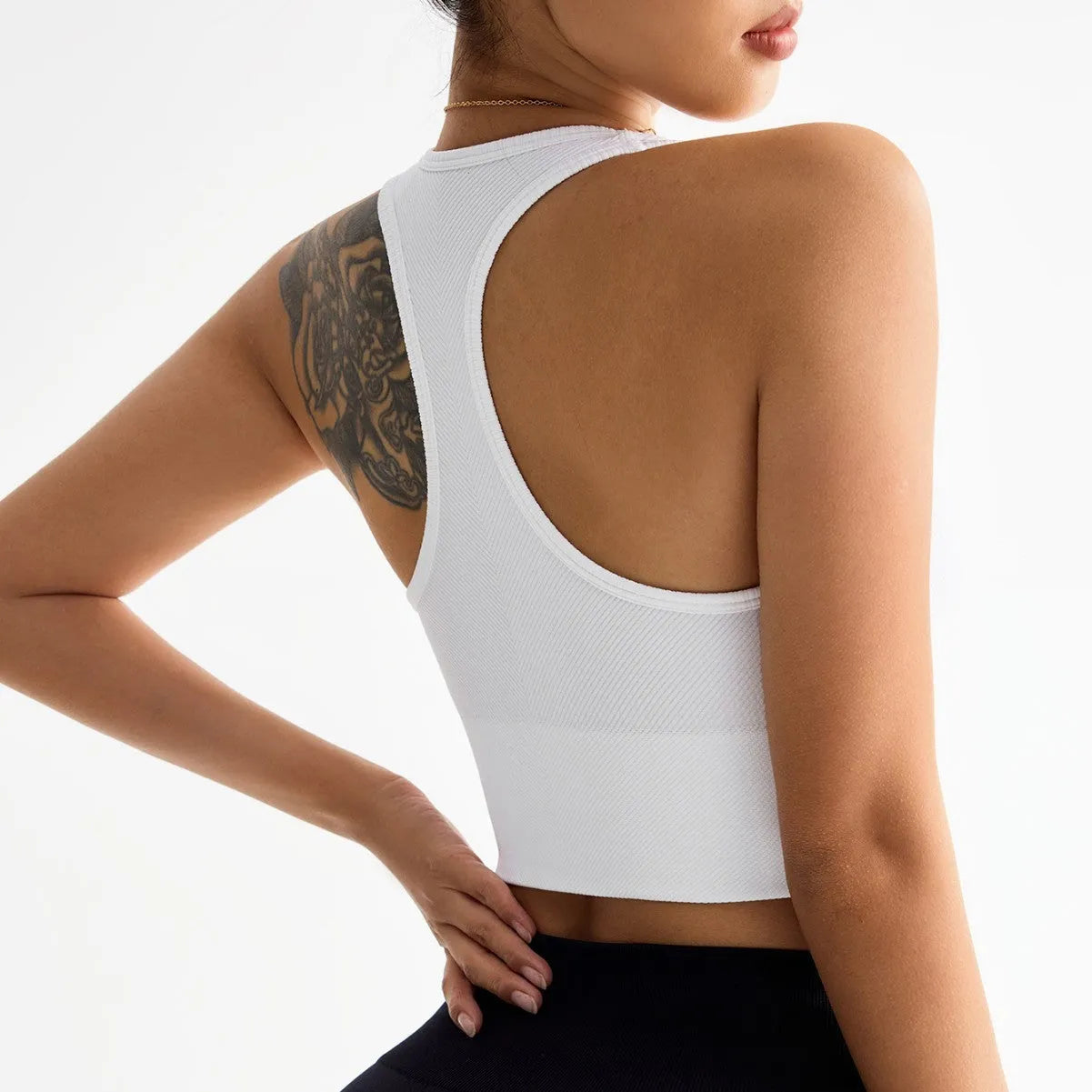 Black women's sports bra with a cross beauty back design and double shoulder straps.