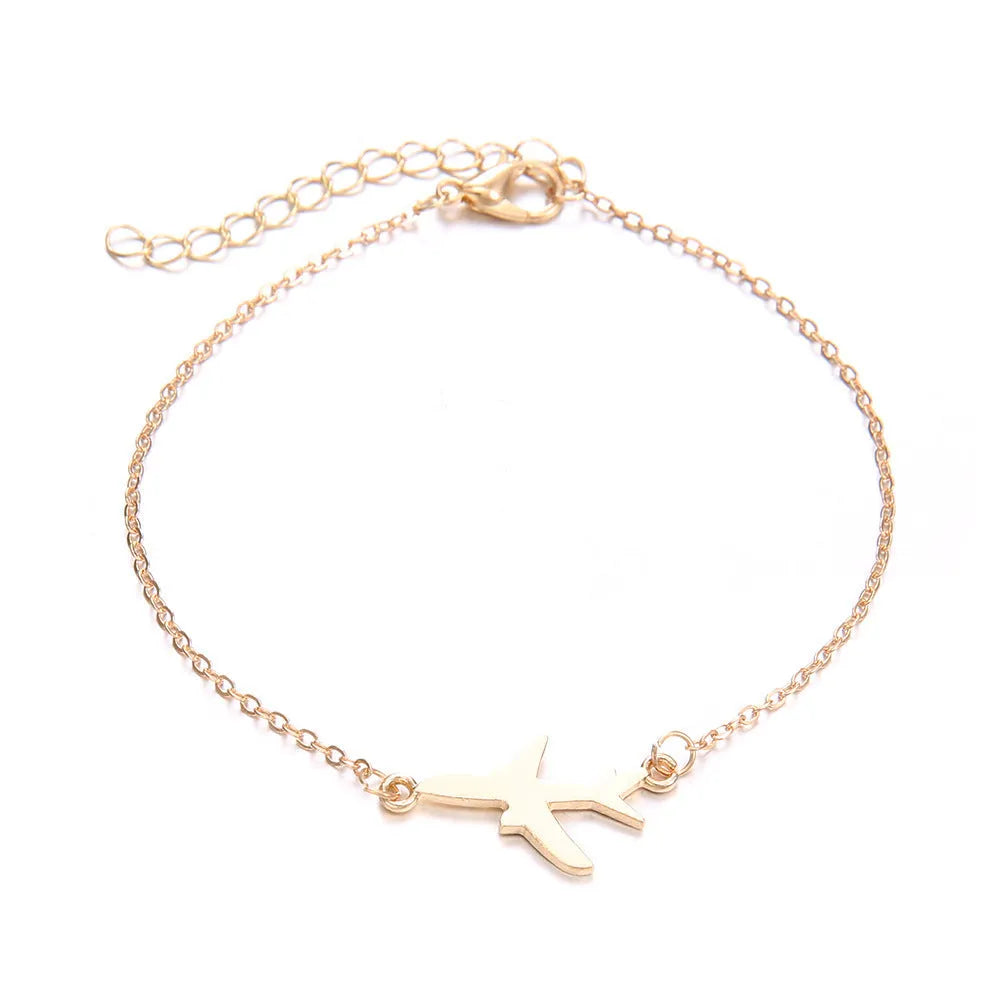 Set of three women's bohemian bracelets with heart-shaped aircraft map charms in alloy.