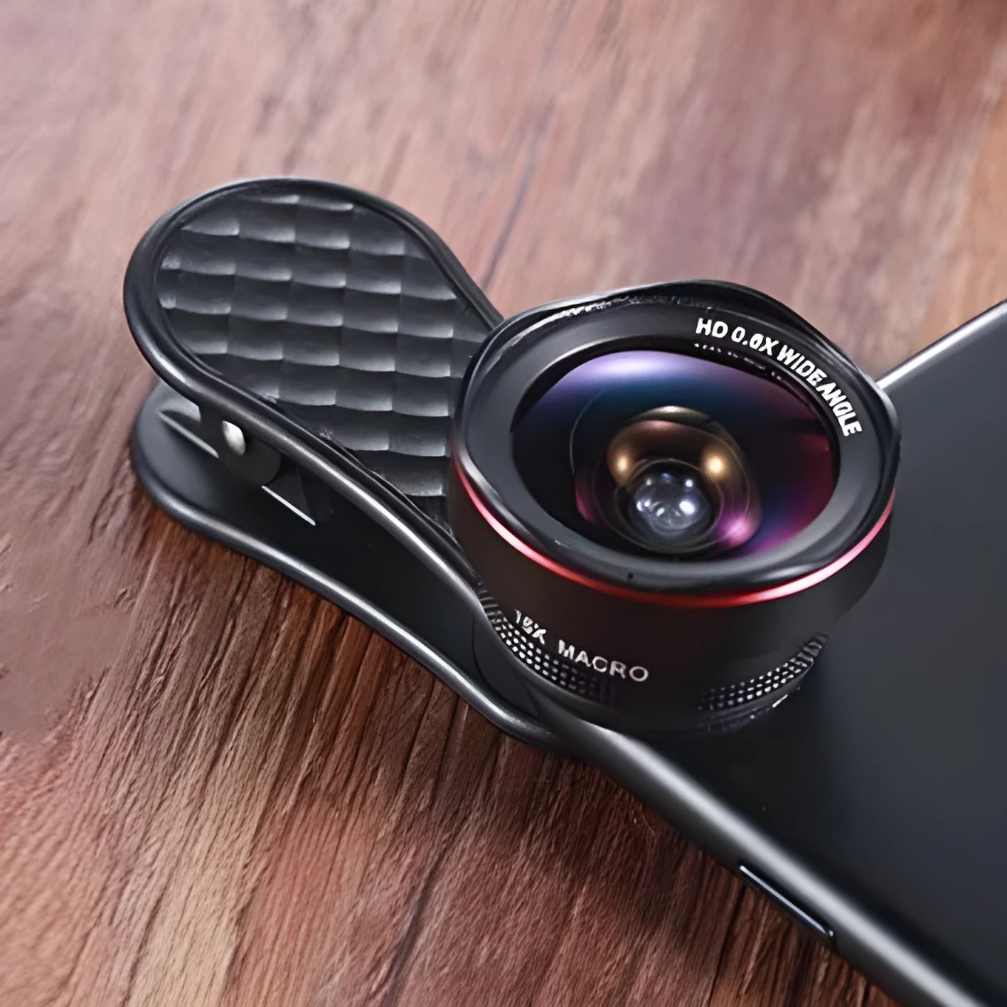 Mobile phone lens kit with 0.6X wide-angle and 15X macro lenses, clip, and storage box
