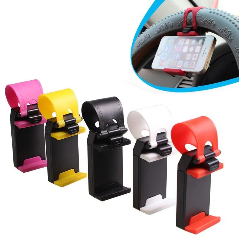Black universal steering wheel phone clip mount holder attached to a car steering wheel.