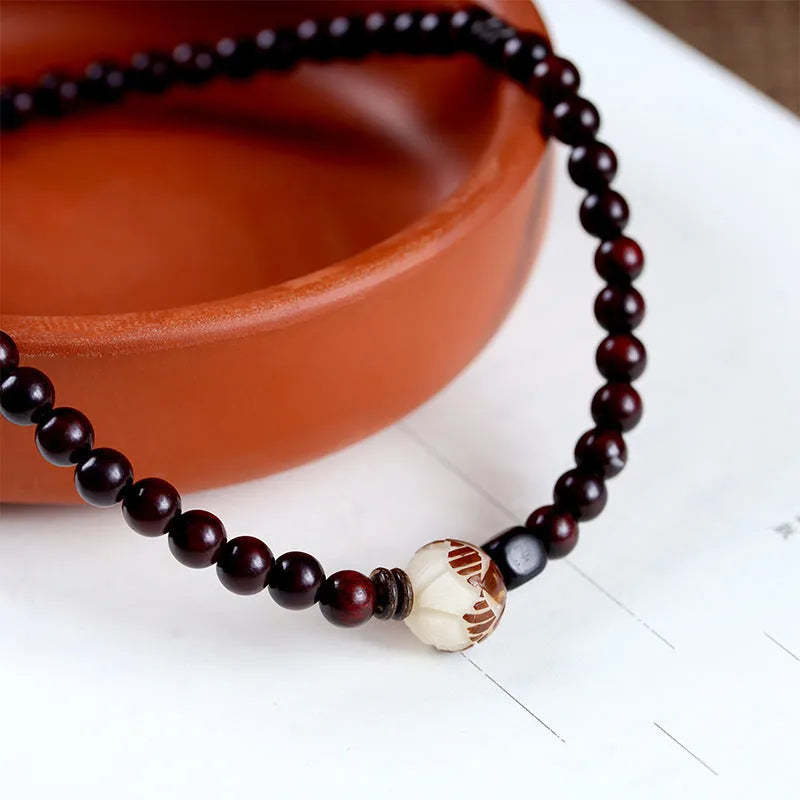 Natural rosewood double-ring bracelet with floral design and knitted construction