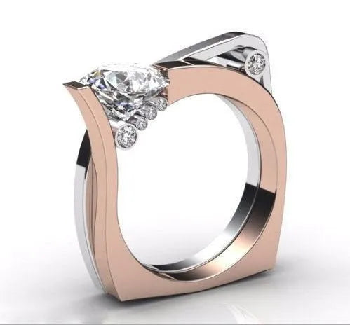 Rose gold geometric women's ring with zircon inlay on a grey background.