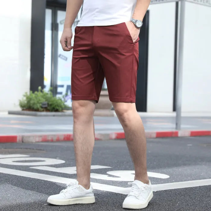 Men's elastic waist fifth pants in polyester fabric showing mid-length design and solid colour options