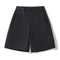 Man wearing khaki 3D cut quick-dry sports shorts with four-way stretch, suitable for running.