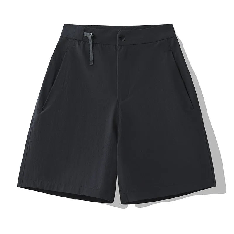 Man wearing khaki 3D cut quick-dry sports shorts with four-way stretch, suitable for running.