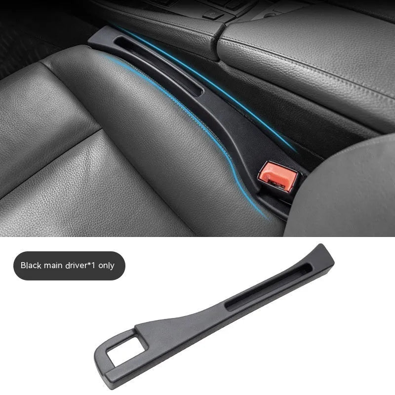 Black plastic car seat gap storage organiser box with handle inserted between vehicle seats