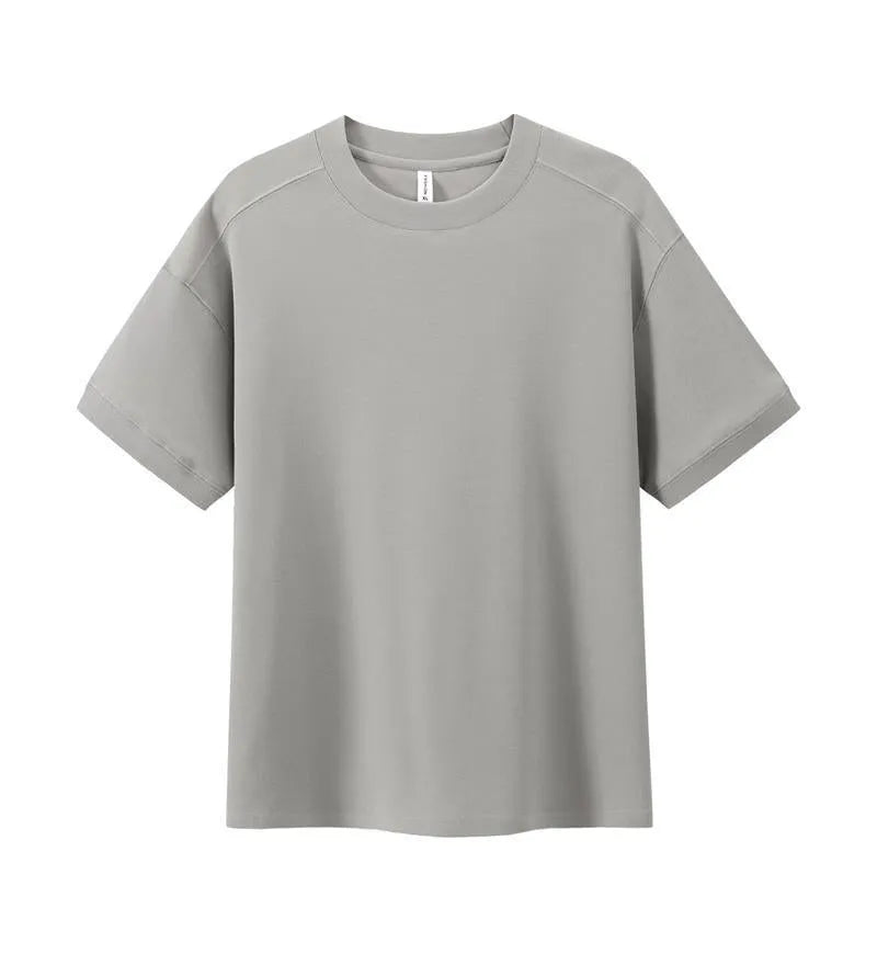 Breathable cotton pique short-sleeved T-shirt in a loose pullover style on a solid colour background.