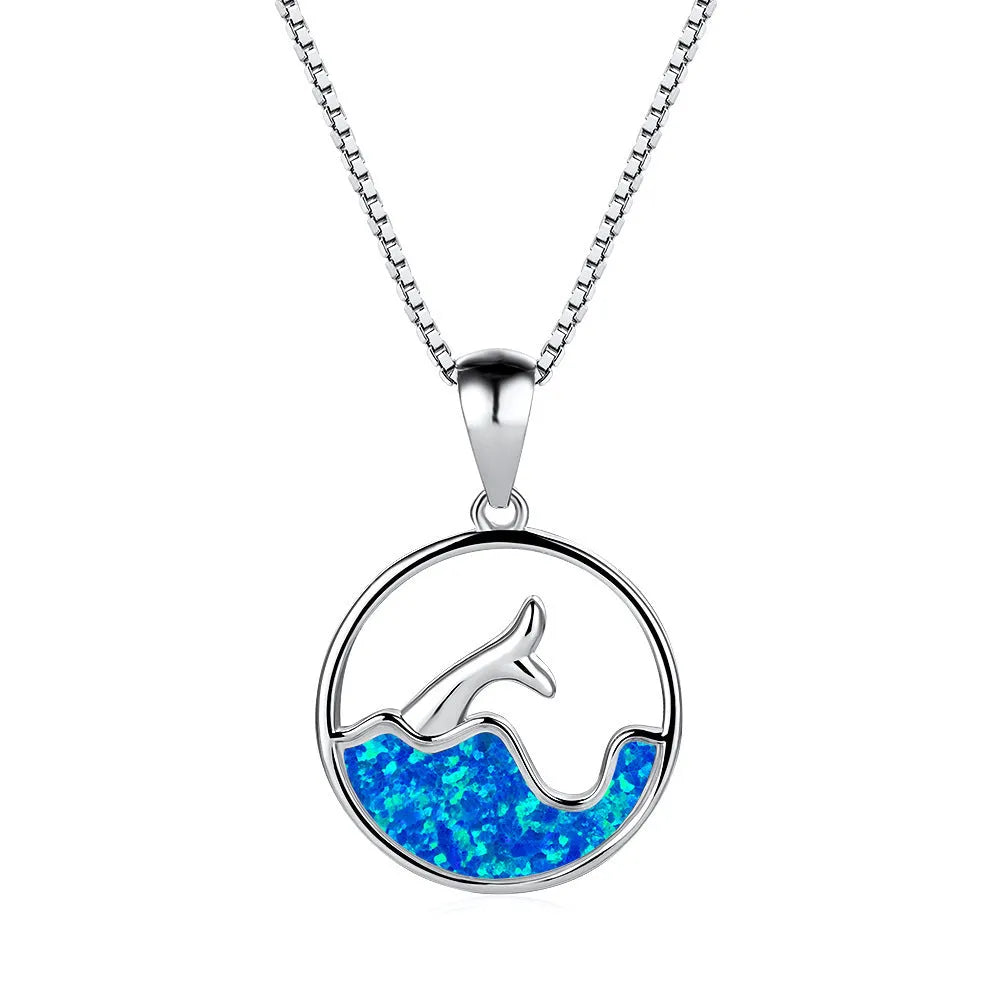 A round geometric pendant necklace with an electroplated opal finish on a copper chain.