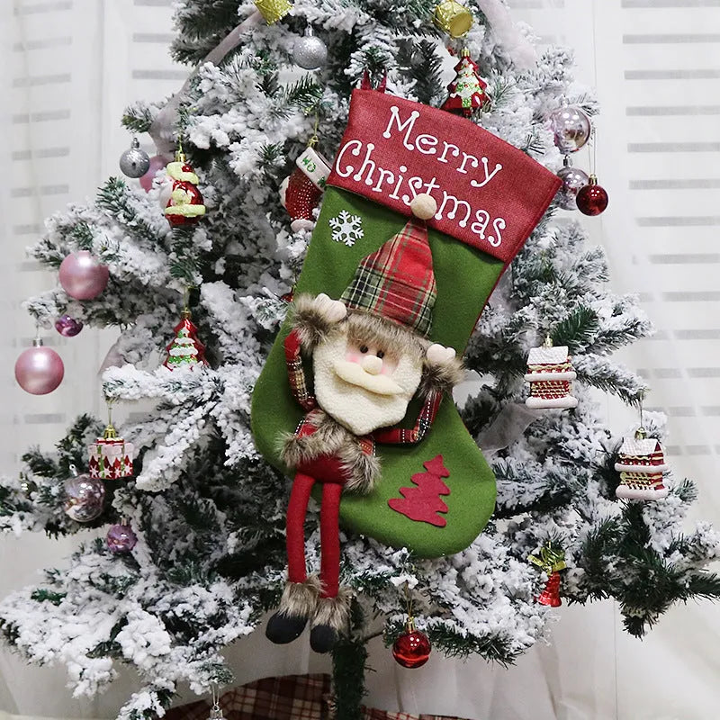 Three large Christmas stockings with 3D Santa, Snowman, and Reindeer designs hanging from loops