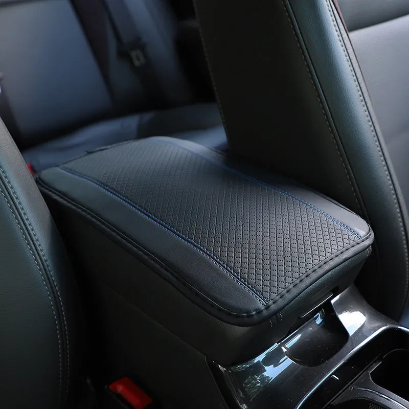 Black PU leather car armrest box cushion mat measuring 32 by 19 centimetres.