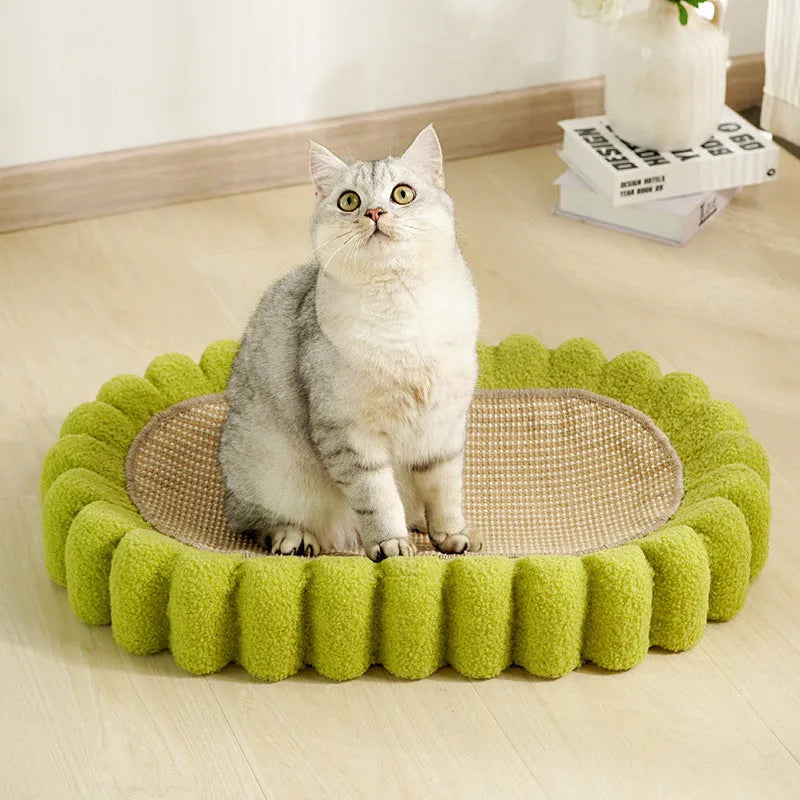 Green oval cat scratching pad and bed made from sisal fibre.