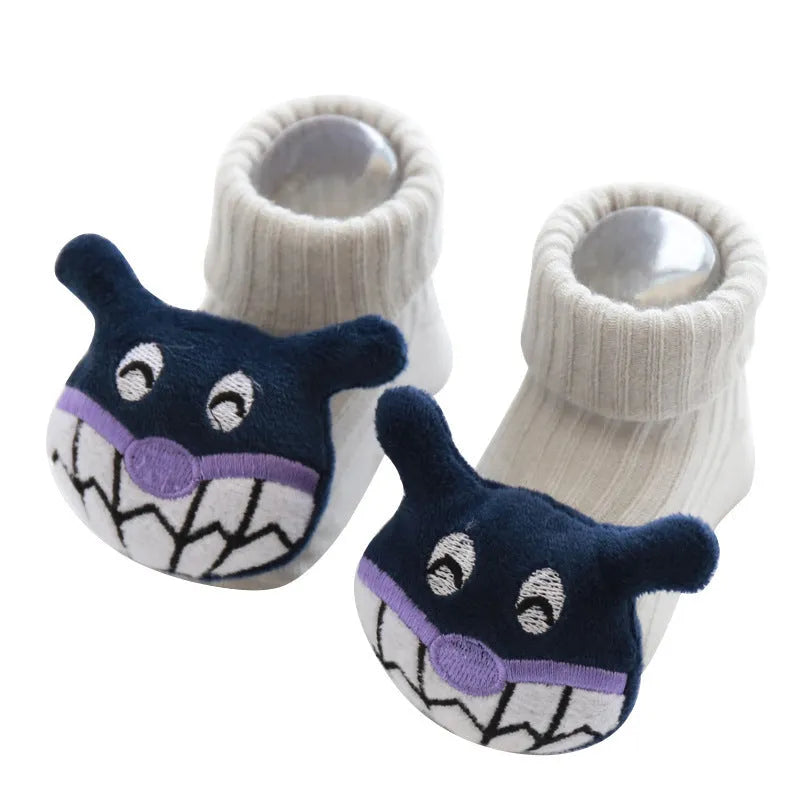 Cotton baby floor socks in assorted colours and prints like blue bow and pink stars on a size chart.