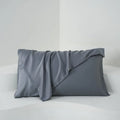 Bamboo fibre satin pillowcase pair in modern simplicity style, one white and one black, measuring 50x77 cm