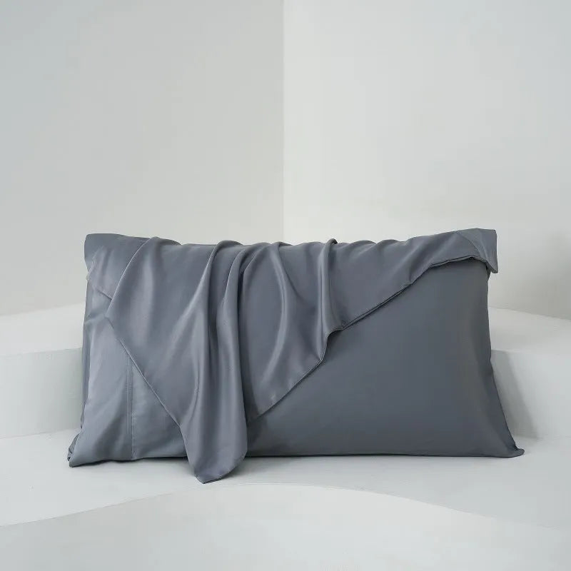 Bamboo fibre satin pillowcase pair in modern simplicity style, one white and one black, measuring 50x77 cm