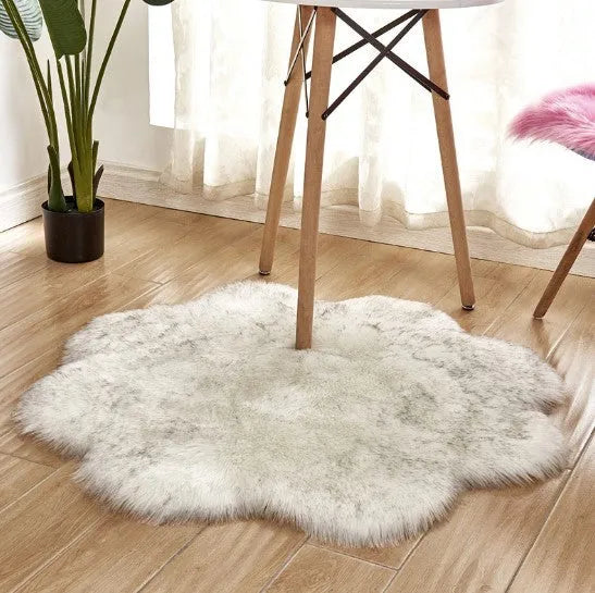 Artificial woolen floral sheepskin hairy plush carpet rug in beige colour, 60x60 cm size, on a tiled floor