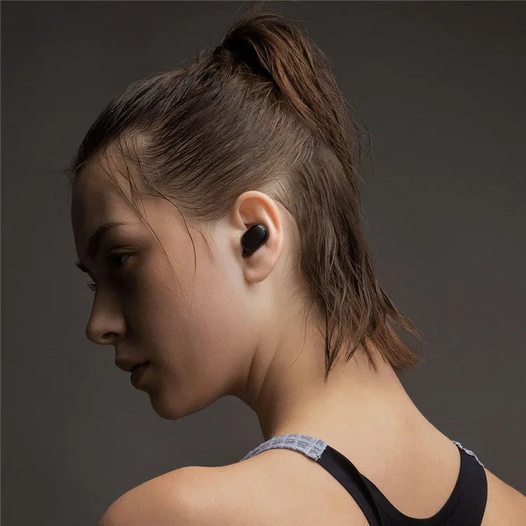 Black Redmi AirDots 2 true wireless earphones with charging case and three sizes of silicone ear tips.