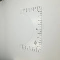 Transparent acrylic sewing ruler measuring 10 by 6 inches for T-shirt patch alignment