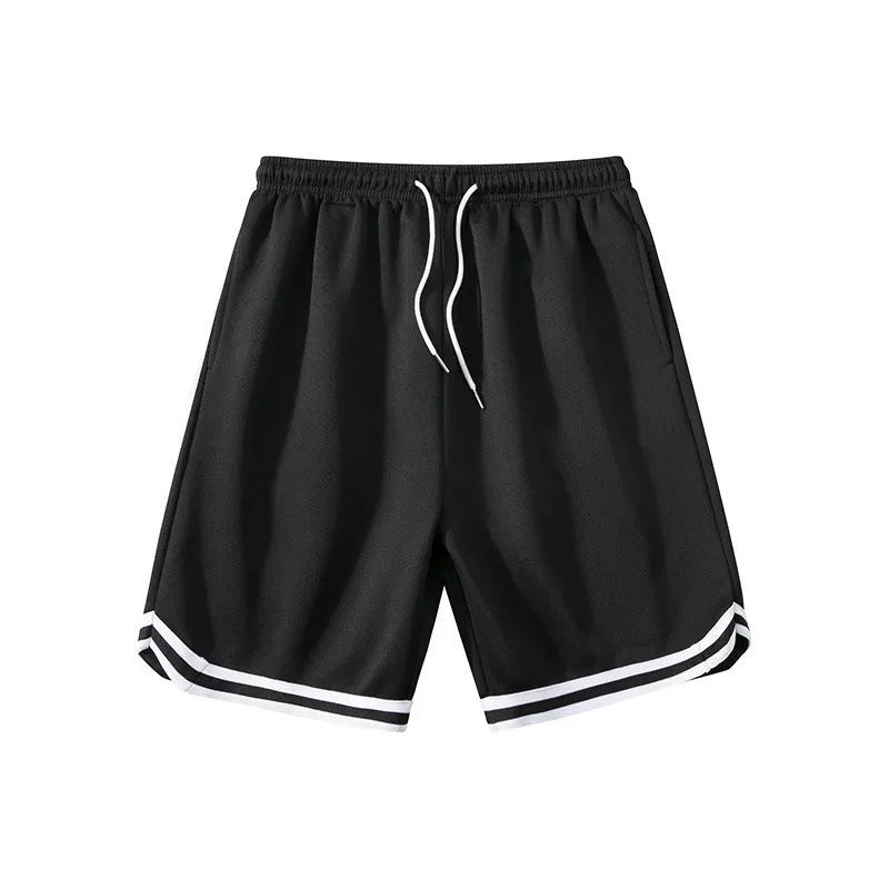 Man wearing loose-fit grey polyester sports shorts with an elastic waistband.