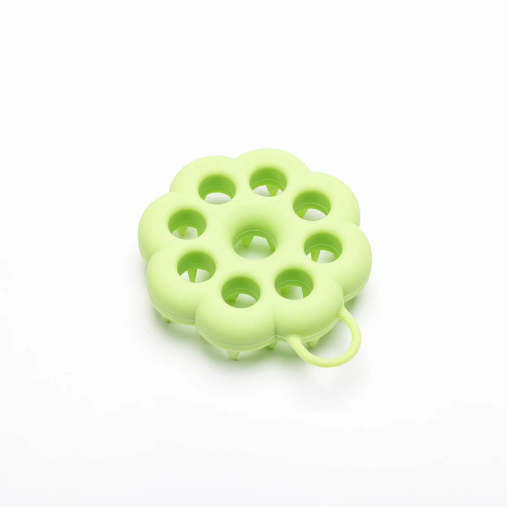 Silicone pet grooming brush with ergonomic handle shown in blue, for use on dog or cat coat during dry grooming or bath.