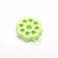 Silicone pet grooming brush with ergonomic handle shown in blue, for use on dog or cat coat during dry grooming or bath.