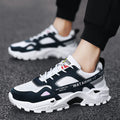 Men's breathable casual sneakers in black white colour-blocked pattern with lace-up front