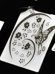 Plastic cake decorating mould showing windmill and flower shapes, folding size 14.5 by 10.5 cm.