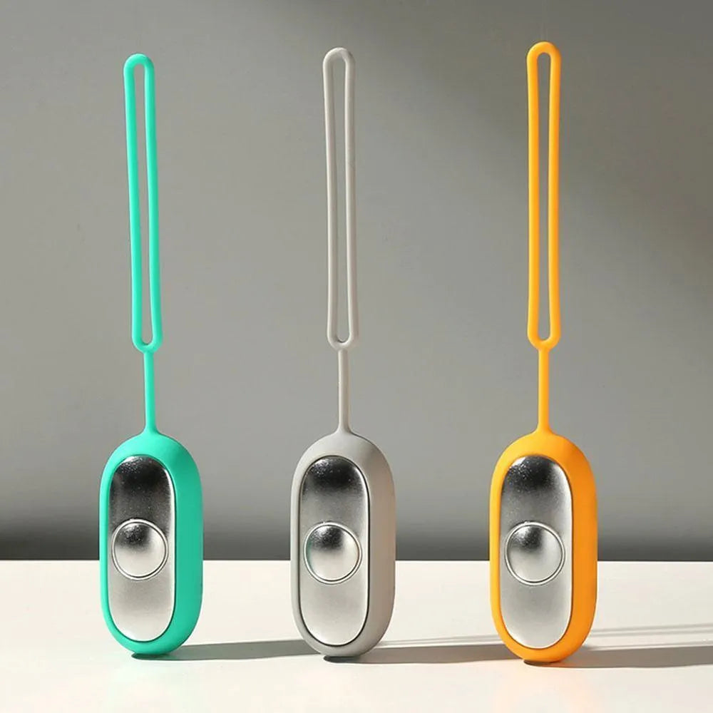 Handheld micro-current sleep aid device in grey colour with USB charging cable