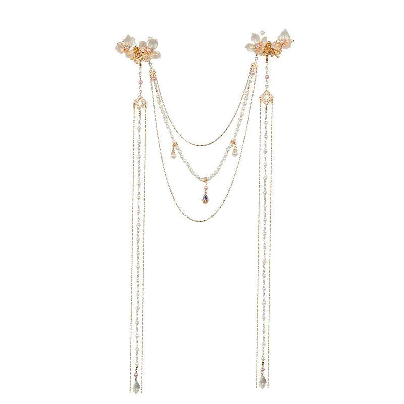 Gold-coloured women's hairpin with acrylic flower design featuring pearl, diamond, and long tassel decorative elements