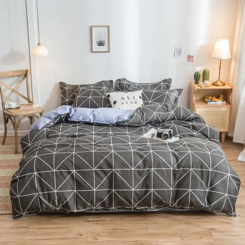 Cotton duvet cover and fitted sheet bedding set in a colour option, shown on a bed