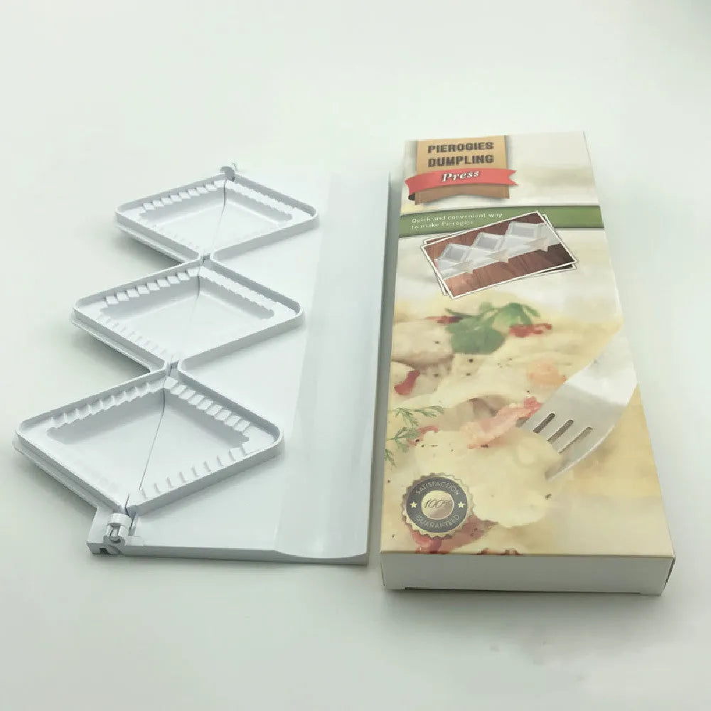 White plastic dumpling mold 28.5cm long on plain background