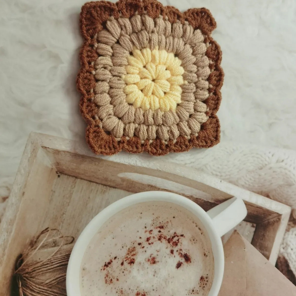 Crocheted wool insulated cup placemat with grandmother lattice pattern in choice of colours