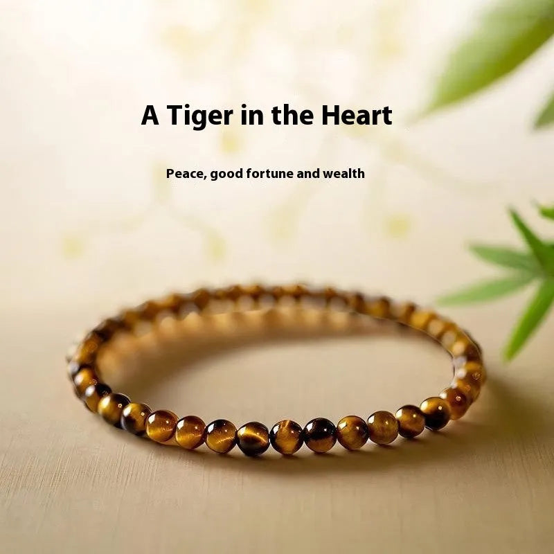Handmade new Chinese style tigereye geometric round bead bracelet showing natural banding patterns