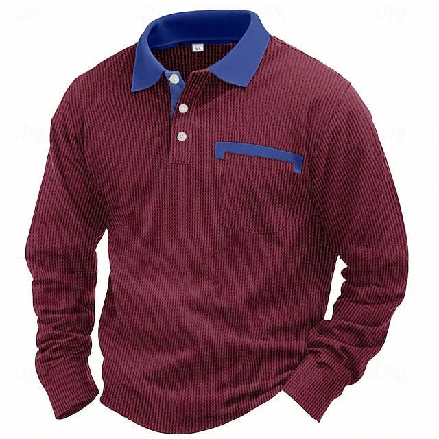Man wearing a long-sleeved waffle-knit polo shirt in a solid colour with a loose, asymmetric retro fit.