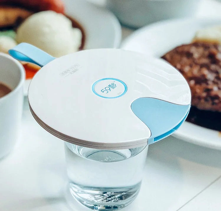 Portable baby bottle steriliser showing compact blue design with USB port and measuring 163.6mm long