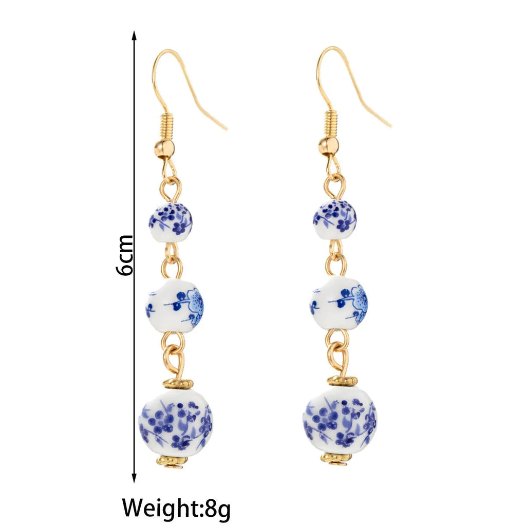 Blue and white porcelain ceramic bead long retro earrings with alloy metal geometric design