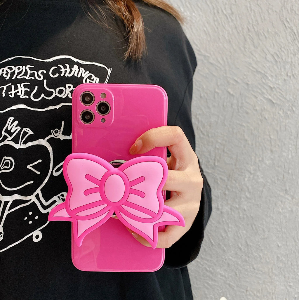 Rose red iPhone case with a pink bow design and a fold-out kickstand on the back.
