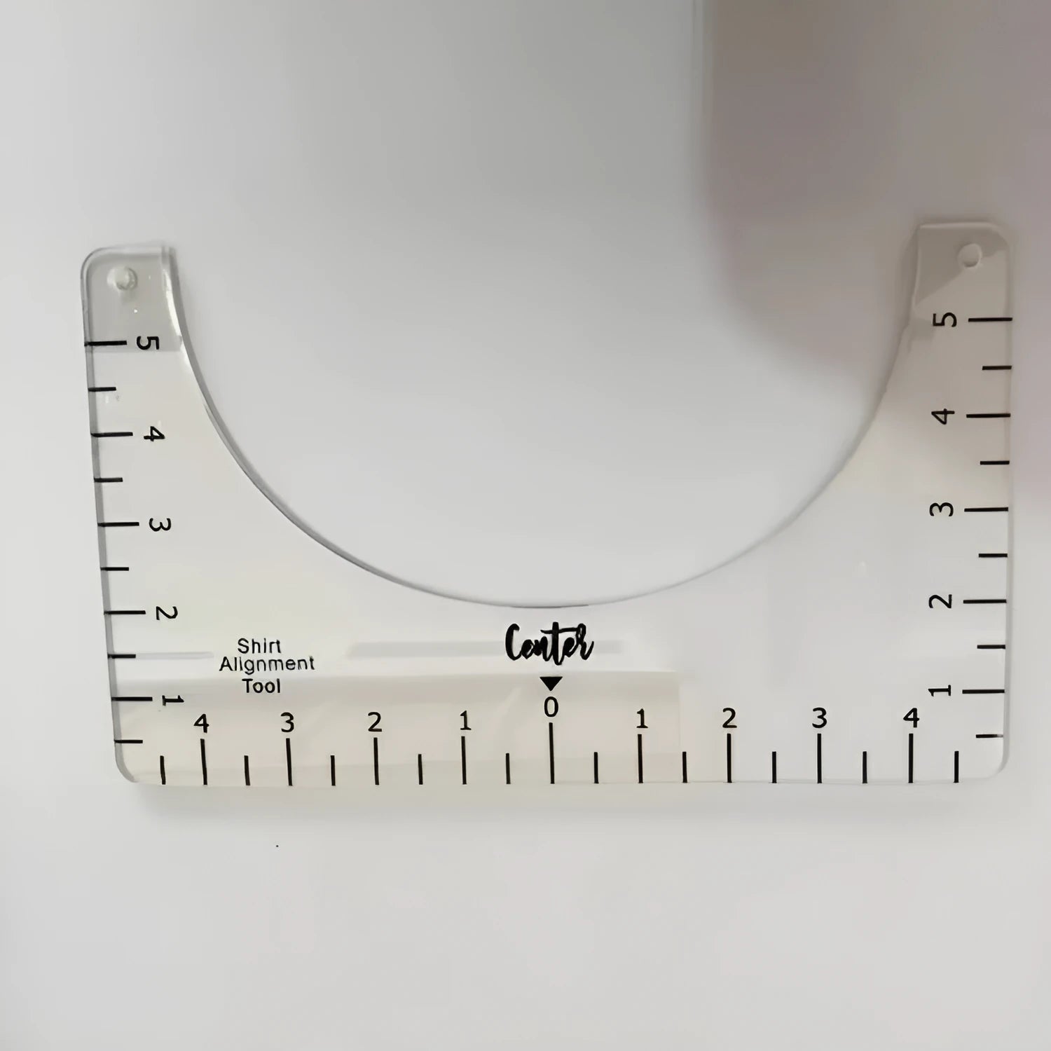 Transparent acrylic sewing ruler measuring 10 by 6 inches for T-shirt patch alignment