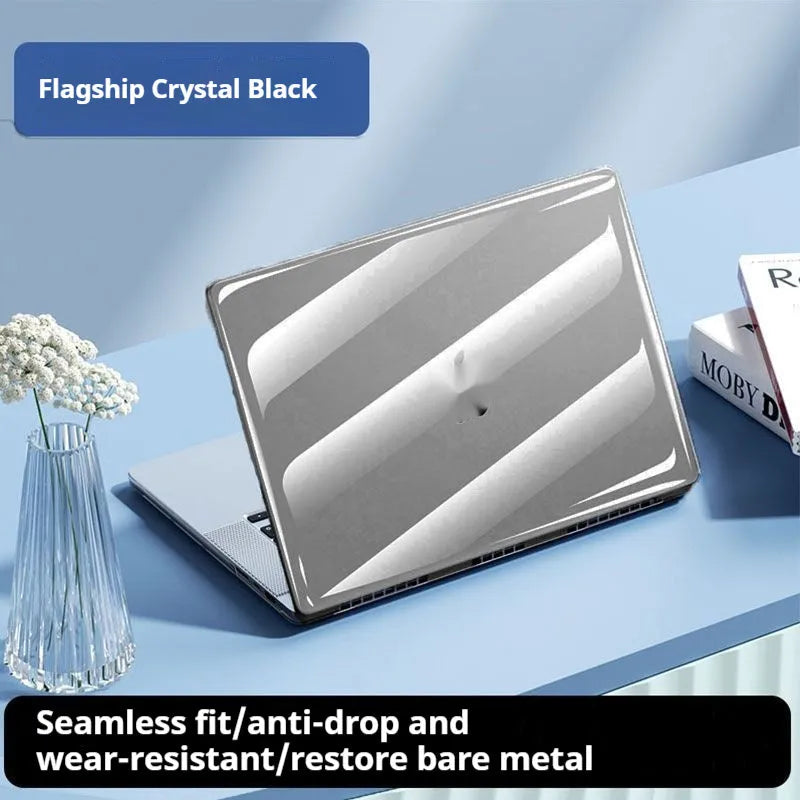 Clear hard plastic protective case for a MacBook laptop on a table.