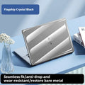 Clear hard plastic protective case for a MacBook laptop on a table.