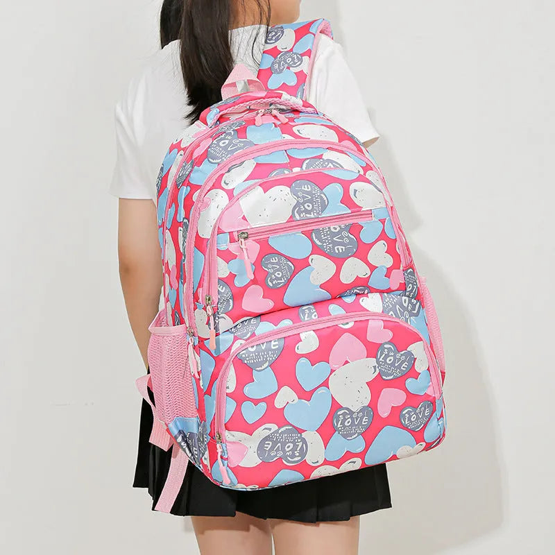 Blue student backpack with air pillow shoulder straps and large main compartment.